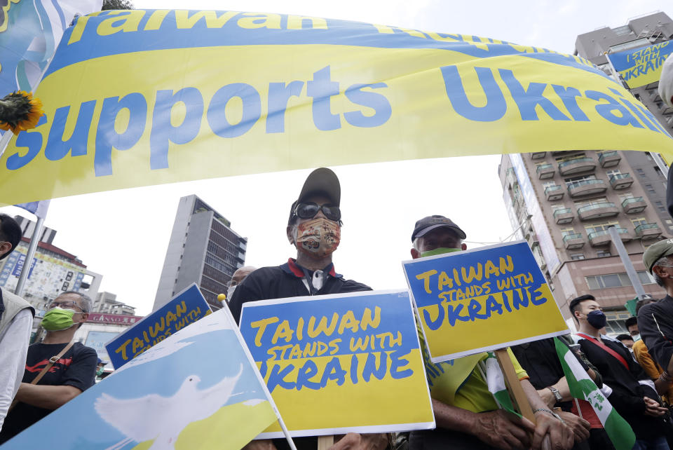 Ukrainian nationals in Taiwan and supporters protest against the invasion of Russia during a march in Taipei, Taiwan, Sunday, March 13, 2022. (AP Photo/Chiang Ying-ying)