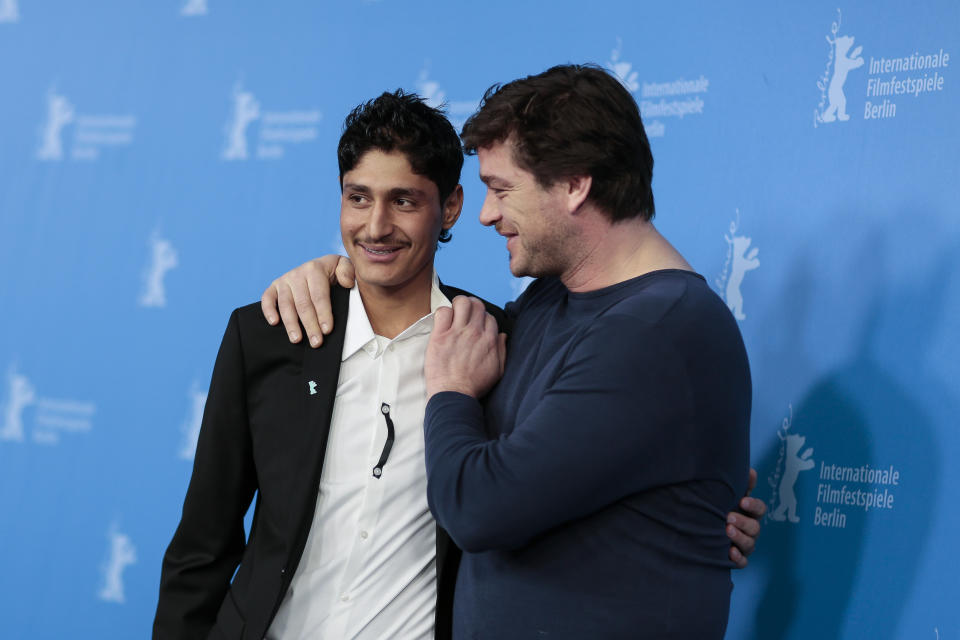 From right, the actors Mohsin Ahmady and Ronald Zehrfeld pose for photographers at the photo call for the film Inbetween Worlds at the Berlinale International Film Festival in Berlin, Tuesday, Feb. 11, 2014. (AP Photo/Markus Schreiber)