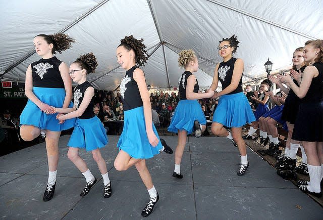Irish dancers from the Robert Thomas Dancenter perform during a past St. Patrick’s Day celebration at Dublin Bay in Ames. This year’s event is canceled because of the spread of the coronavirus. Ames Tribune file photo