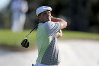 Bryson DeChambeau tees off on the 3rd hole during the second round of the Masters Friday, Nov. 13, 2020, in Augusta, Ga. (Curtis Compton/Atlanta Journal-Constitution via AP)