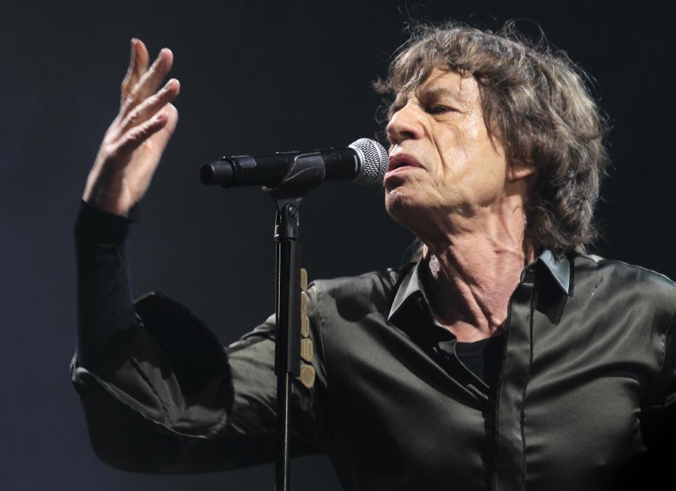 Mick Jagger of The Rolling Stones performs at Glastonbury, England on Saturday, June 29, 2013. Thousands are to enjoy the three day festival that started on Friday, June 28, 2013 with headliners Arctic Monkeys, the Rolling Stones and Mumford and Sons. (Photo by Jim Ross/Invision/AP)