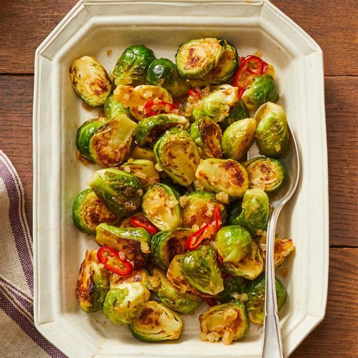 <p>For a tasty vegetarian appetizer option, look no further than these tangy Brussels sprouts that take less than 30 minutes to cook.</p><p><strong><em><a href="https://www.womansday.com/food-recipes/food-drinks/a29462636/sweet-and-sour-brussels-sprouts-recipe/" rel="nofollow noopener" target="_blank" data-ylk="slk:Get the recipe for Sweet and Sour Brussels Sprouts" class="link ">Get the recipe for Sweet and Sour Brussels Sprouts</a>.</em></strong></p>