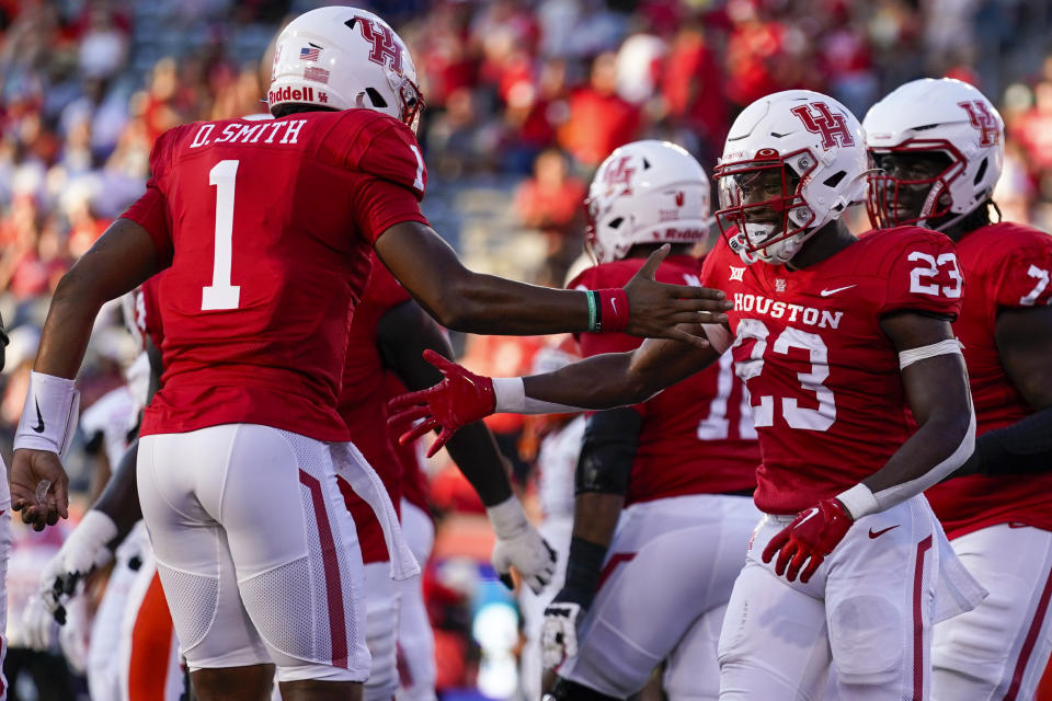 Houston running back Parker Jenkins (23) celebrates his touchdown with quarterback Donovan Smith (1) during the first half of an NCAA college football game against Sam Houston State, Saturday, Sept. 23, 2023, in Houston. (AP Photo/Eric Christian Smith)