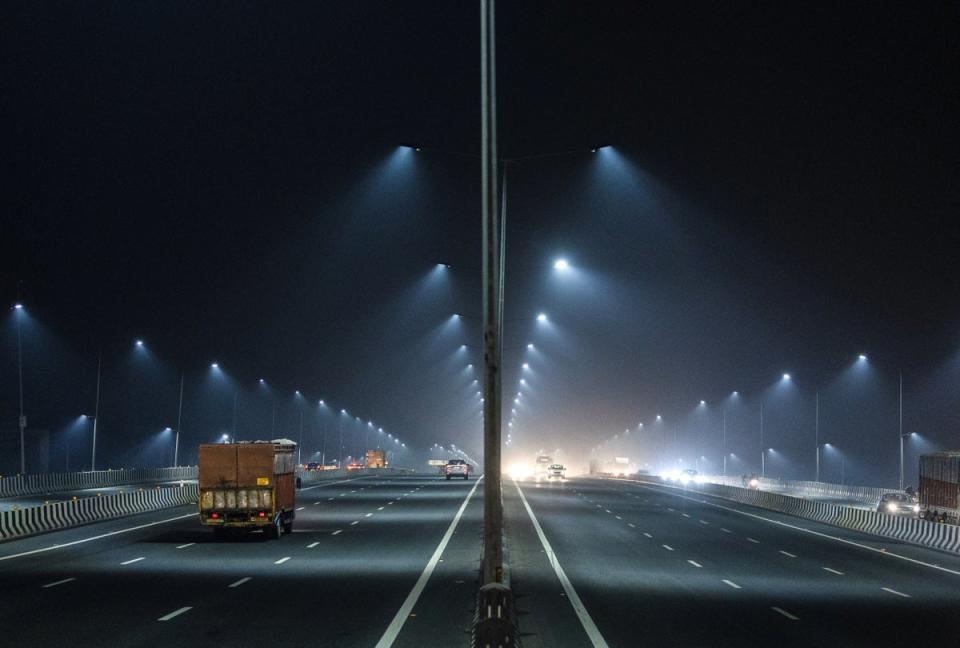 Traffic moves along a highway in the haze (Reuters)