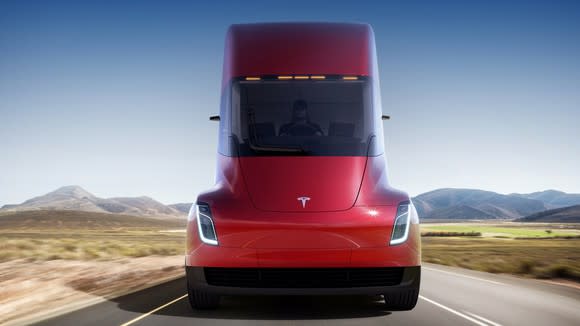 The front of a red Tesla Semi.