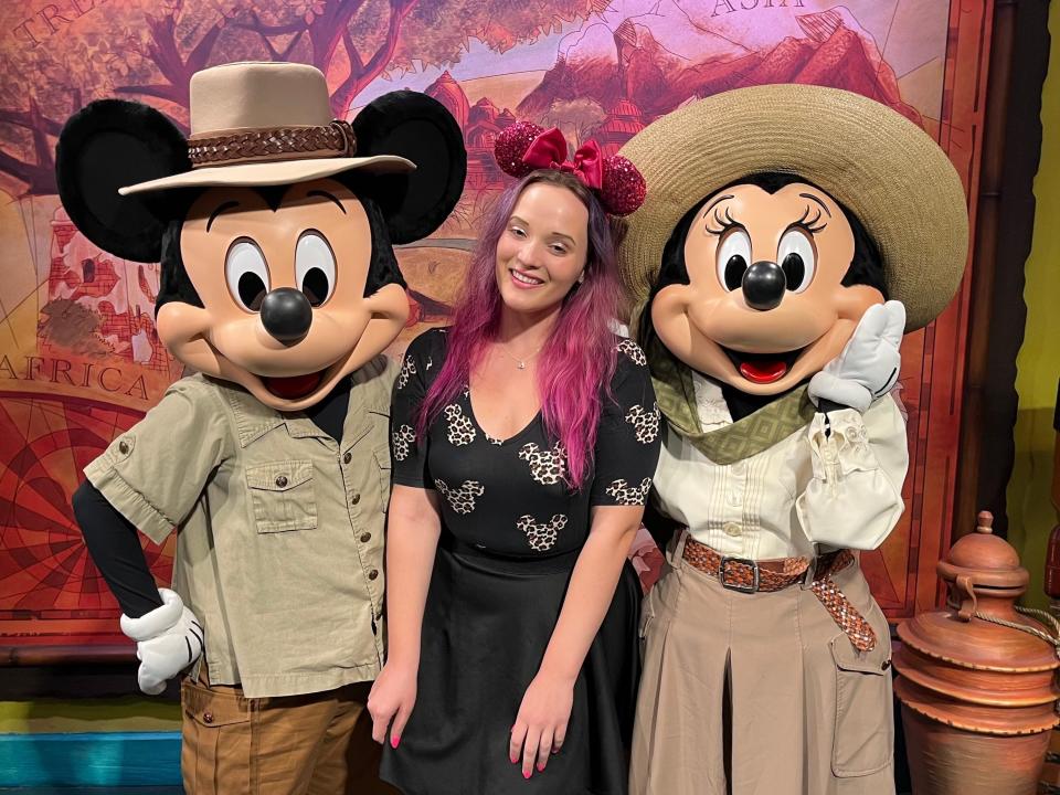 jenna clark with mickey and minnie at the outpost