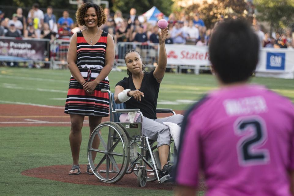 Capitol Police officer Crystal Griner throws out the first pitch in the Congressional Women's Softball game, June 21, 2017.