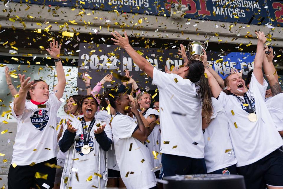 Courage players celebrate their 2022 Challenge Cup victory.