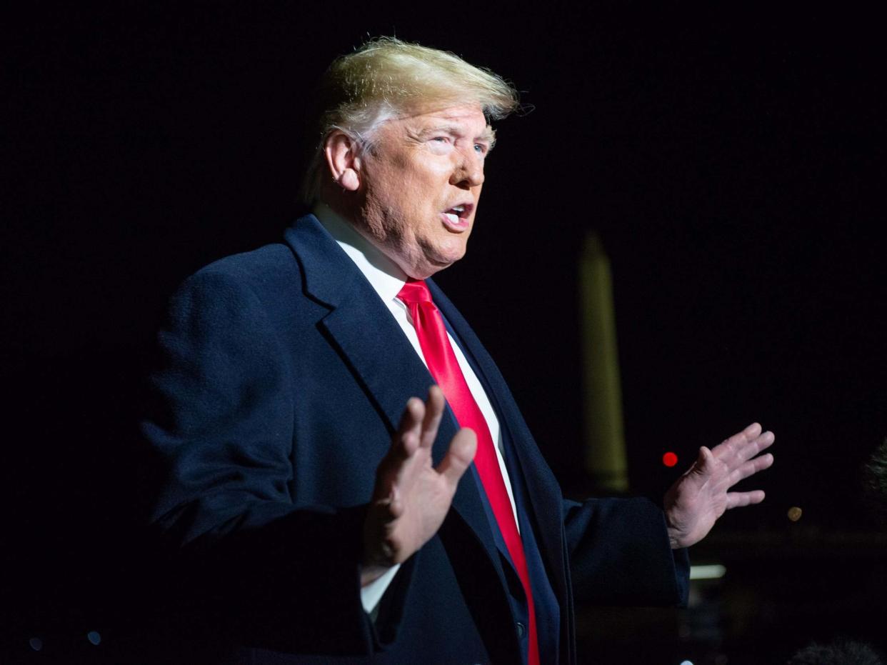 US president Donald Trump speaks to reporters before departing the White House en route to New York, Washington, DC, on 2 November 2019: Erin Scott/EPA