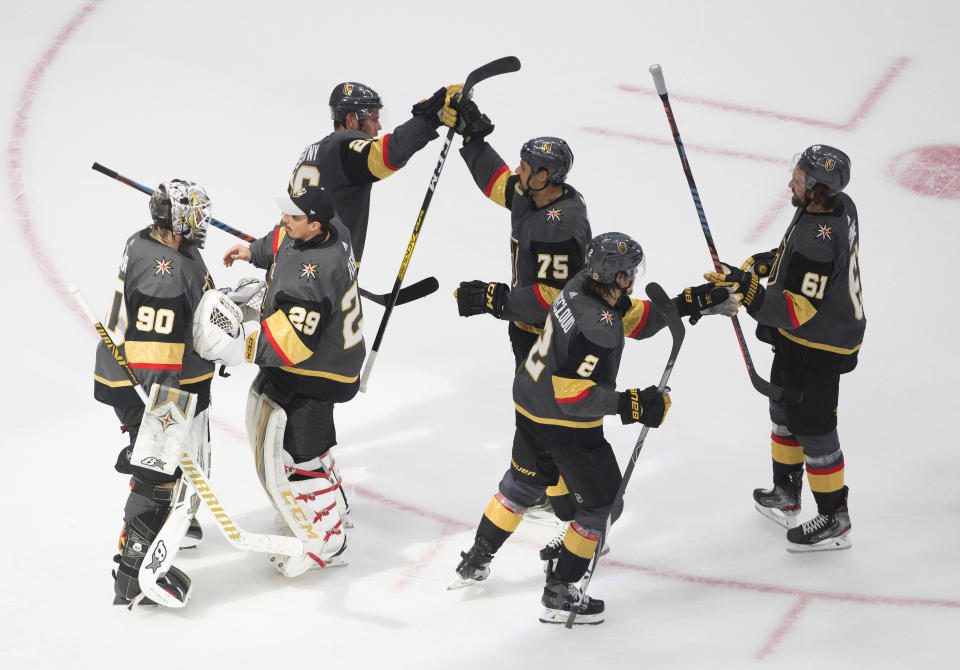 Vegas Golden Knights celebrate a 3-0 win over the Dallas Stars in Game 2 of the NHL hockey Western Conference final, Tuesday, Sept. 8, 2020, in Edmonton, Alberta. (Jason Franson/The Canadian Press via AP)