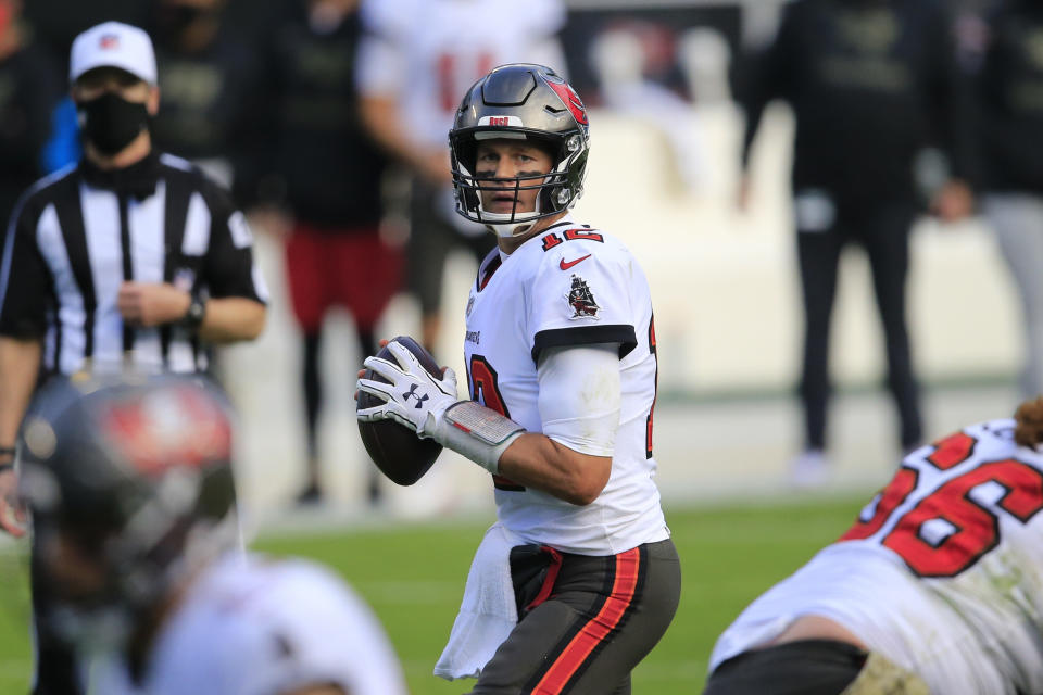 Tampa Bay Buccaneers quarterback Tom Brady works in the pocket against the Carolina Panthers during an NFL game.