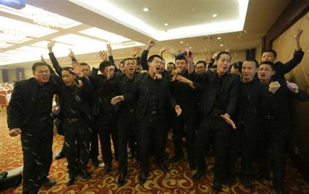 Students at Tianjiao Special Guard/Security Consultant sing during a group dinner on the outskirts of Beijing December 14, 2013. REUTERS/Jason Lee