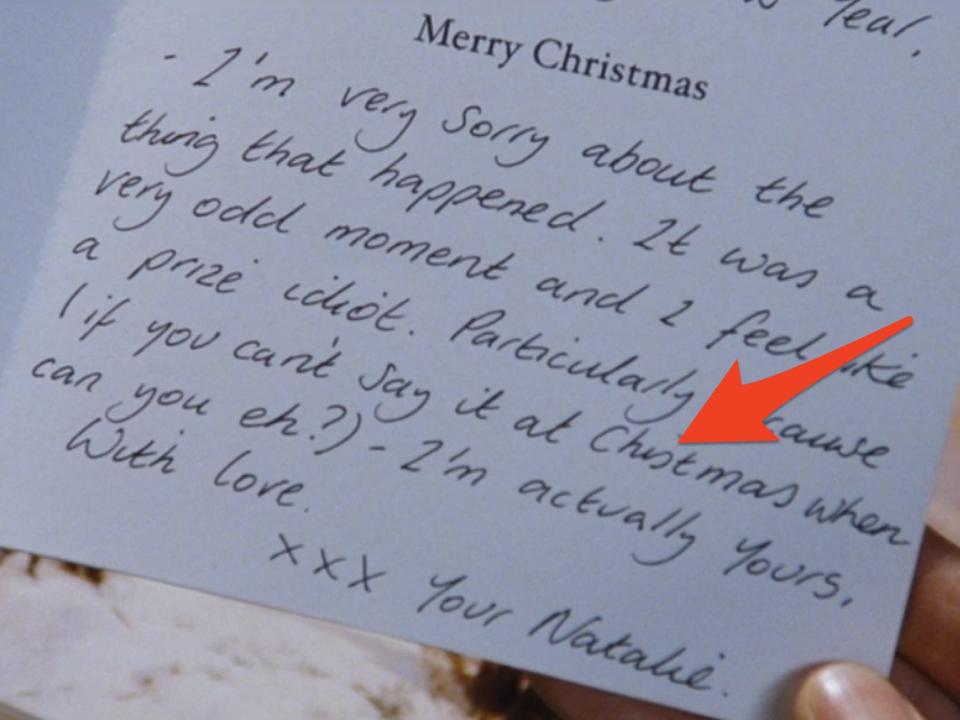 arrow pointing to misspelled "chistmas" on a holiday card in love actually
