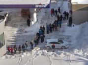 Customers line up outside a gas bar in St. John's on Sunday, Jan. 19, 2020. The state of emergency ordered by the City of St. John's continues, leaving businesses, with the exception of pharmacies and service stations that provide fuel for snow removal, closed and vehicles off the roads in the aftermath of the major winter storm that hit the Newfoundland and Labrador capital. THE CANADIAN PRESS/Andrew Vaughan