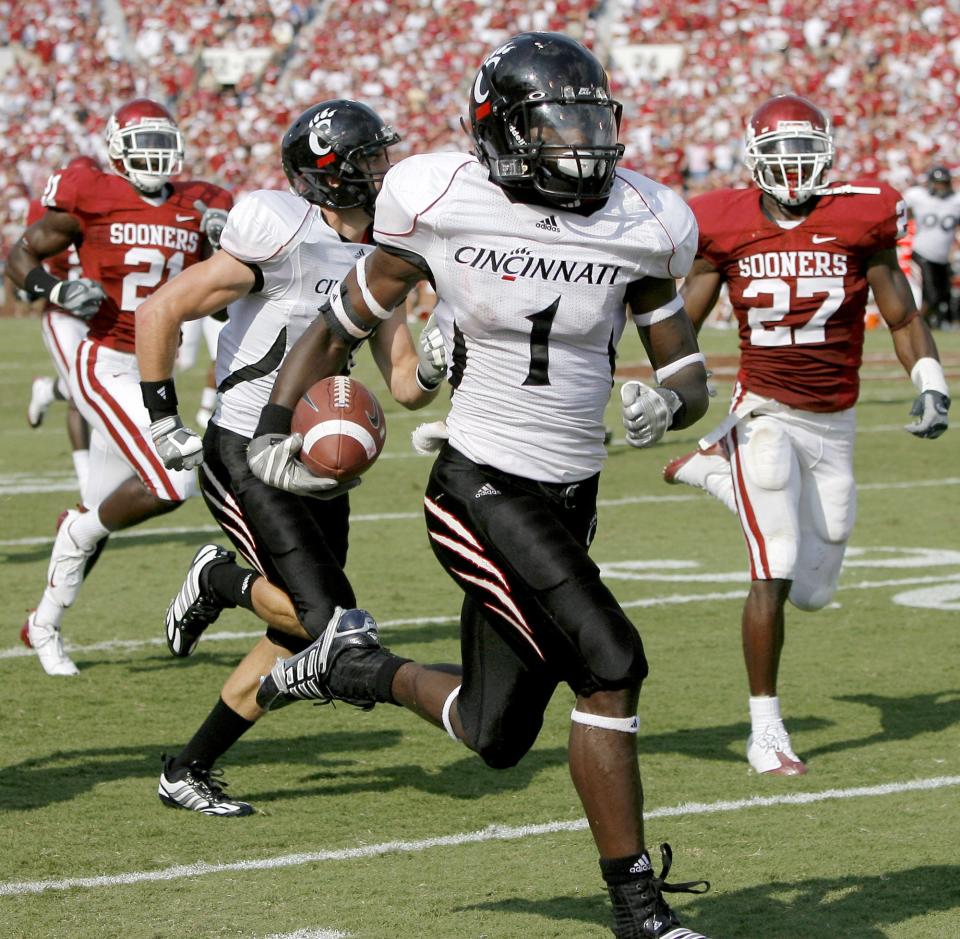 Mardy Gilyard of Cincinnati runs a kickoff back for a touchdown against the University of Oklahoma at Oklahoma Memorial Stadium Sept. 6, 2008.