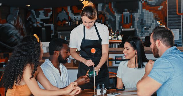 <p>Getty</p> Stock image of a group being served