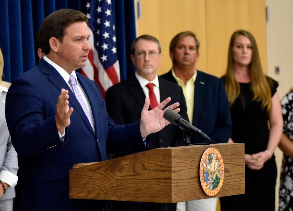 Florida Gov. Ron DeSantis appeared at an Oct. 20, 2021, press conference in Titusville to decry the mask mandates that flouted his emergency order. In the background (second from left) is Jeffrey Steel, the stepfather of a Brevard special needs student whose mask was tied to her face with a nylon cord.