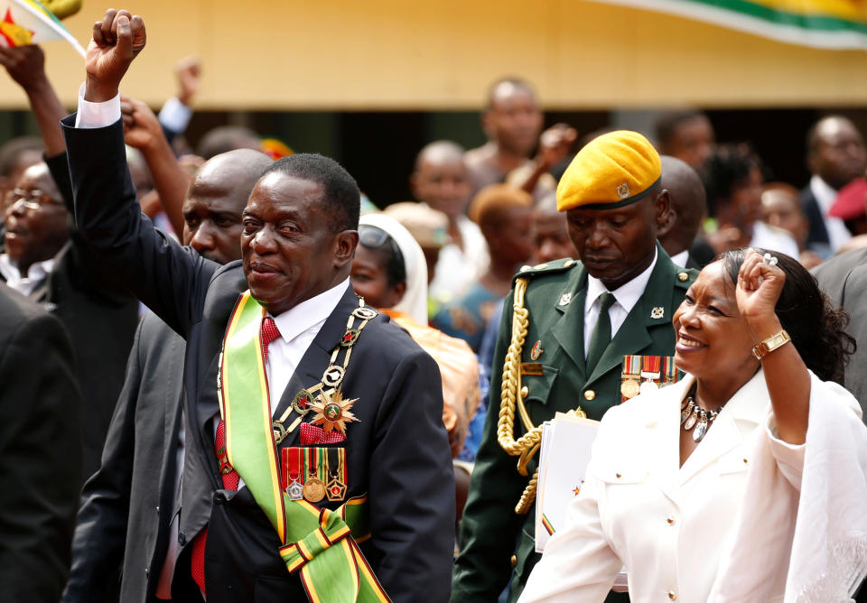 <p>Zimbabwe’s new president Emmerson Mnangagwa and his wife Auxillia wave to their suppoters as they leave after the swearing in ceremony in Harare, Zimbabwe, Nov. 24, 2017. (Photo: Siphiwe Sibeko/Reuters) </p>