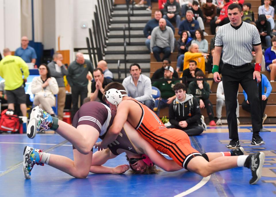 Churchville-Chili’s Cael Raines, right, wrestles HF-L’s Waylan Winseman in the final of the 145-pound weight class during the Monroe County Wrestling Championships, Saturday, Dec. 16, 2023.