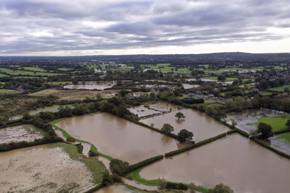 Flooded fields near Lingfield in Surrey, after southern England was hit overnight by heavy rain and strong winds from Storm Aurore moving in from France, Thursday, Oct. 21, 2021. (Steve Parsons/PA via AP)