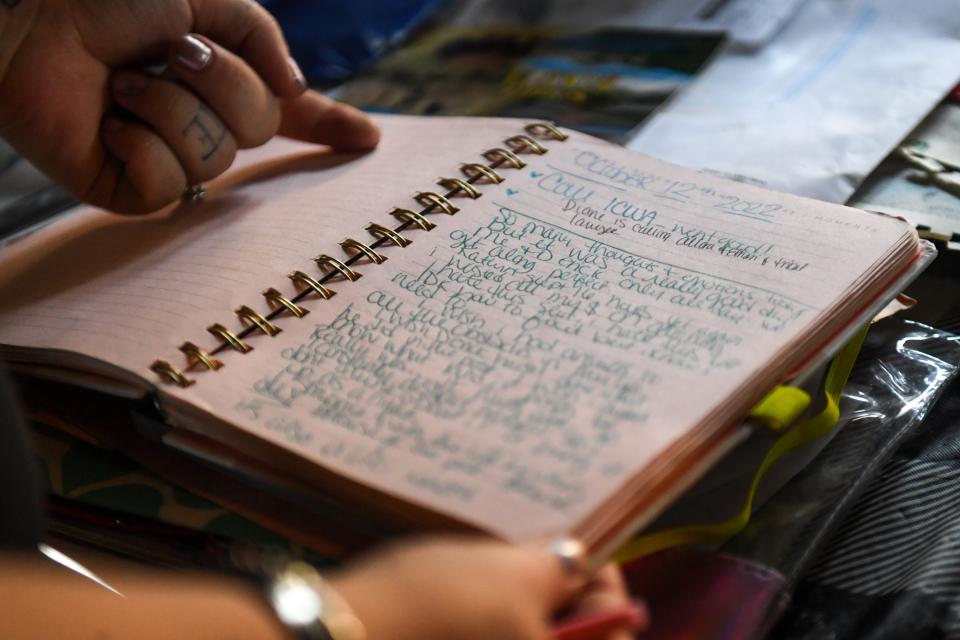 Christian Banley reads her journal in her Aberdeen home on Wednesday, Aug. 23, 2023. The journal she kept contains positive notes to herself, actions she planned to do with ICWA and reflections of how she felt after interactions she had with others.
(Credit: Samantha Laurey / Argus Leader)