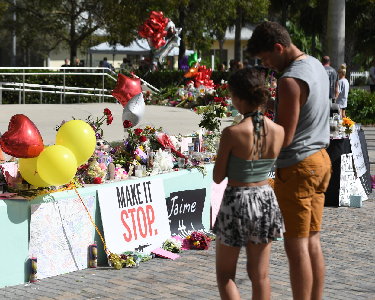 The community gathers to pay its respects to the shooting victims at Marjory Stoneman Douglas High School in Parkland, Fla. (Photo: mpi04/MediaPunch/IPX)