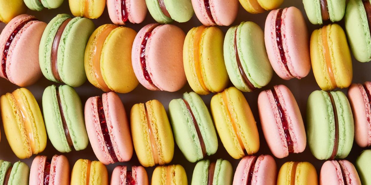 pink, green, and yellow macarons lined up together