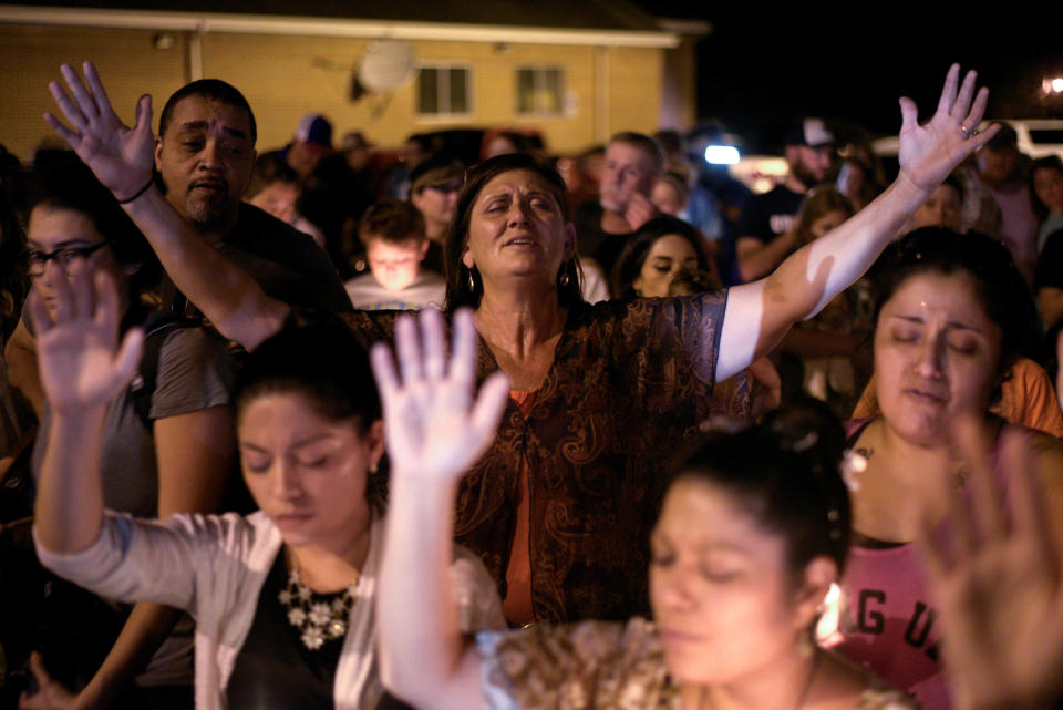 Michaun Johnson attends a candlelight vigil.