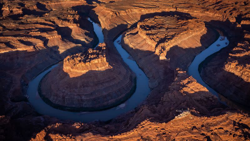 The Colorado River cuts its path through southern Utah near Moab on Friday, July 22, 2022.