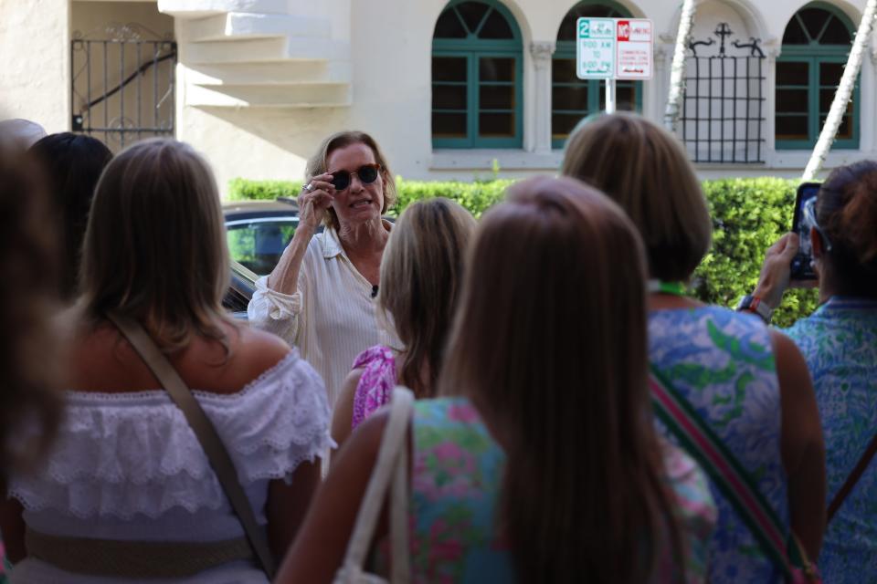 Leslie Diver of Island Living leads a group of women on a Worth Avenue walking tour Friday as part of the fifth Pink Retreat for fans of Lilly Pulitzer.