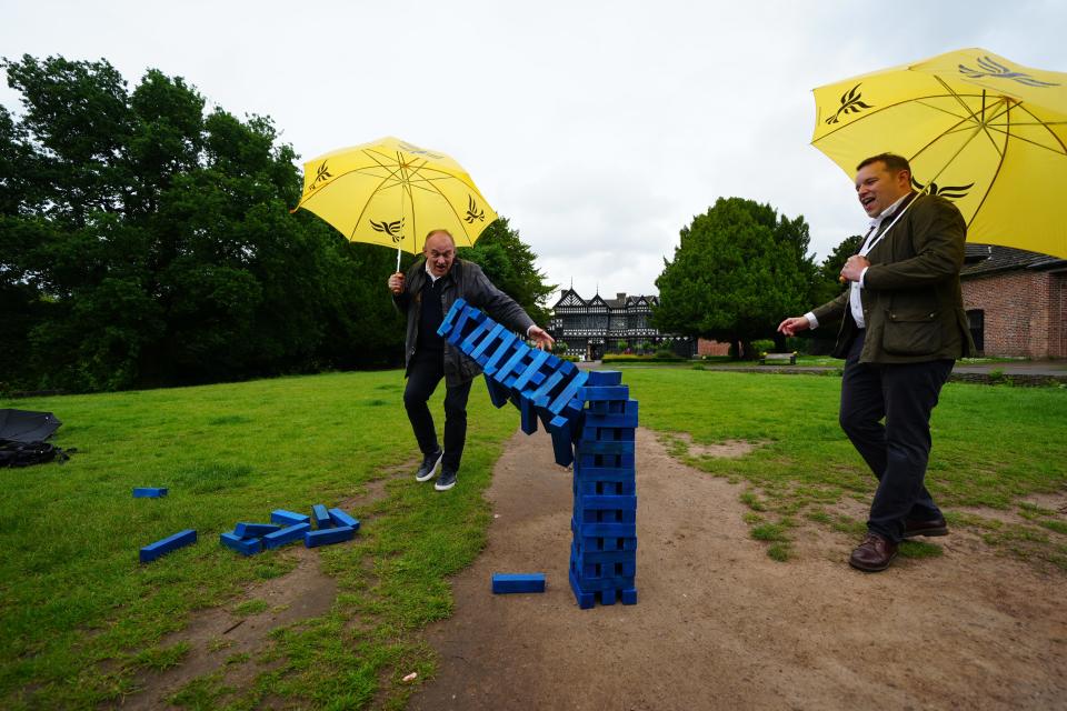 Lib Dem leader Sir Ed Davey and his party’s candidate for Cheadle, Tom Morrison, play Jenga during a visit to Cheadle, Greater Manchester during day 13 of the election campaign (Peter Byrne/PA) (PA Wire)