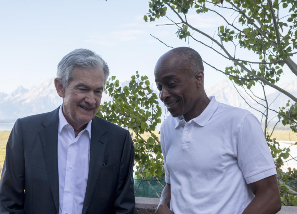 Federal Reserve Chairman Jerome Powell, left, chats with economist Philip Jefferson outside of Jackson Lake Lodge during the Jackson Hole Economic Symposium near Moran in Grand Teton National Park, Wyo., Friday, Aug. 25, 2023. (AP Photo/Amber Baesler)