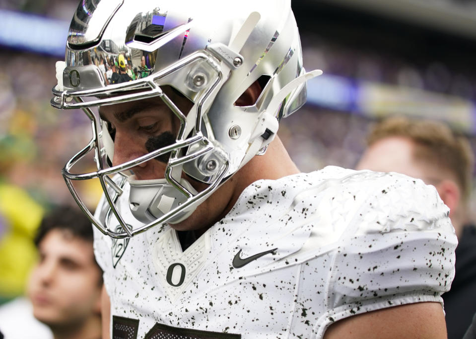 Oregon quarterback Bo Nix walks to the locker room after the first half of an NCAA college football game against Washington, Saturday, Oct. 14, 2023, in Seattle. (AP Photo/Lindsey Wasson)