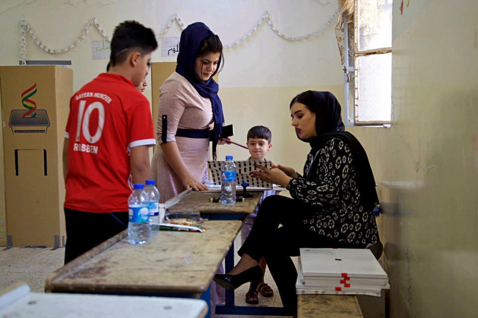 Iraqi Kurds participate in parliamentary elections in Irbil, Iraq, Sunday, Sept. 30, 2018. Iraq's self-ruled Kurdish region held long-delayed parliamentary elections on Sunday, a year after a vote for independence sparked a punishing backlash from Baghdad, leaving Kurdish leaders deeply divided. (AP Photo/Salar Salim)