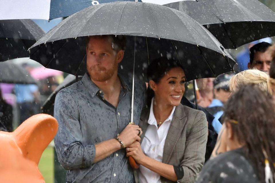 <p><strong>17 October </strong>The couple looked delighted as rain descended on the arid land.</p>