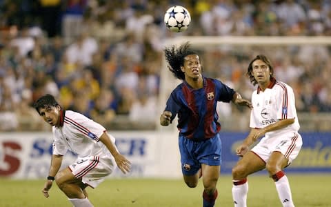 Ronaldinho playing against AC Milan in 2003 - Credit: GETTY IMAGES