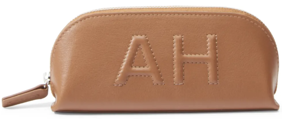 light brown leather sunglasses case with letters "AH" monogrammed