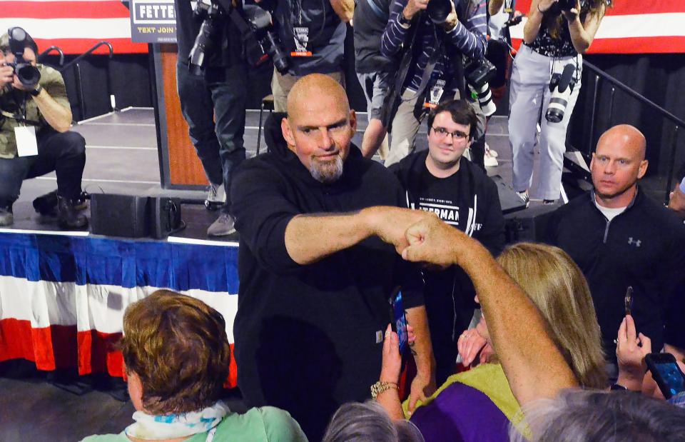 Pennsylvania Lt. Gov. and Democratic Senate nominee John Fetterman, center, greets supporters after speaking inside the Bayfront Convention Center in Erie on Aug. 12, 2022. It was Fetterman's first campaign event since suffering a stroke on May 13.