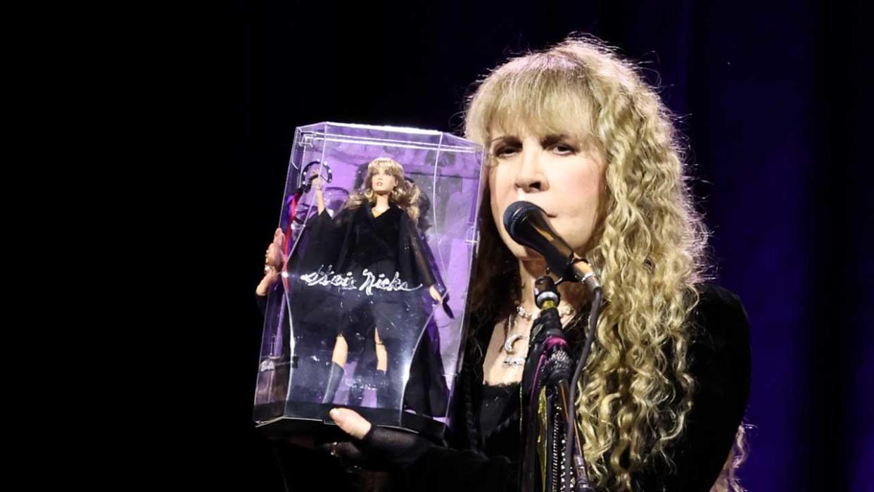  Stevie Nicks onstage at Madison Square Garden with Barbie Doll in her likeness. 