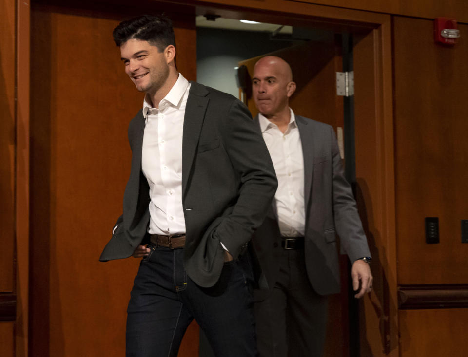 New White Sox outfielder Andrew Benintendi, left, arrives alongside manager Pedro Grifol for a news conference Wednesday, Jan. 4, 2023 at Guaranteed Rate Field in Chicago. (Brian Cassella/Chicago Tribune via AP)