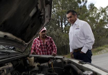 Jaime Rodriguez (R), independent candidate for governor of Nuevo Leon state, stands next to a supporter, whose car suffered a mechannical failure, in the town of Aramberri, Mexico, June 2, 2015. Rodriguez, alias &quot;El Bronco,&quot; would cause one of the biggest upsets in Mexican political history if his anti-establishment campaign claims the wealthy northern state of Nuevo Leon in midterm elections to be held next Sunday. A former member of President Enrique Pena Nieto&#39;s centrist Institutional Revolutionary Party, or PRI, the 57-year-old Rodriguez launched his bid thanks to a change in the law that now allows independent candidates to run for high office. REUTERS/Daniel Becerril