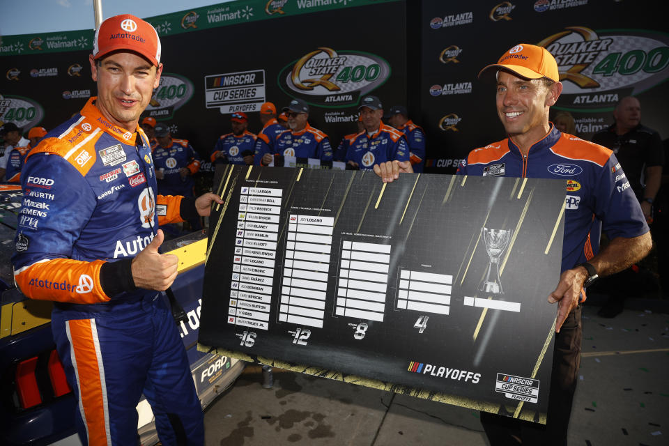 HAMPTON, GEORGIA - SEPTEMBER 08: Joey Logano, driver of the #22 Autotrader Ford, poses with the 2024 NASCAR Playoffs Grid Challenge in victory lane after winning the NASCAR Cup Series Quaker State 400 Available at Walmart at Atlanta Motor Speedway on September 08, 2024 in Hampton, Georgia. (Photo by Sean Gardner/Getty Images)