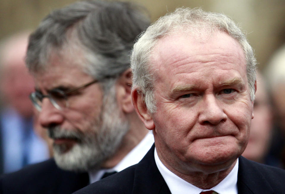 FILE - In this Wednesday, Nov. 27, 2013, file photo Sinn Fein's Martin McGuinness, right, and Gerry Adams attend the funeral of Catholic Priest Alec Reid Clonard Monastery, West Belfast, Northern Ireland. Relations between Britain and Ireland have experienced many highs and lows in a century marked by rebellion, terror and treaties. (AP Photo/Peter Morrison, File)