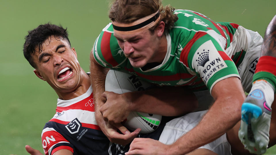 Joseph Suaalii makes a tackle against South Sydney.