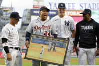 Detroit Tigers' Miguel Cabrera (24) reacts as New York Yankees' Gleyber Torres, left, Aaron Judge and Luis Severino, right, present him gifts during a pre-game ceremony before a baseball game Tuesday, Sept. 5, 2023, in New York. (AP Photo/Adam Hunger)