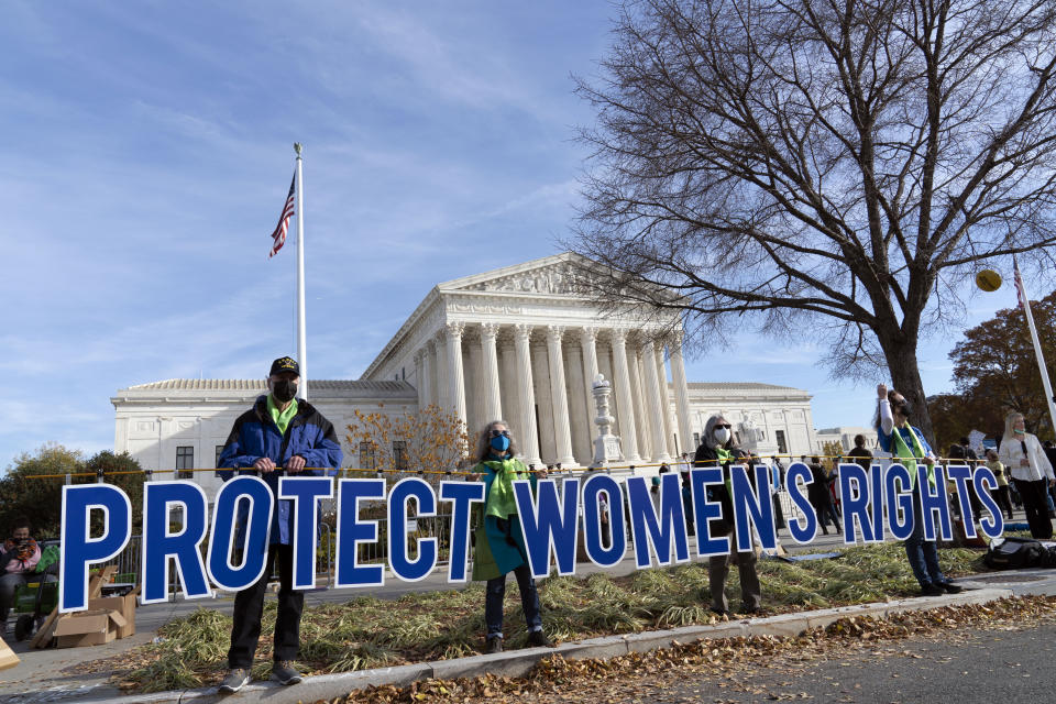 Abortion rights advocates demonstrate in front of the U.S. Supreme Court Wednesday, Dec. 1, 2021, in Washington, as the court hears arguments in a case from Mississippi, where a 2018 law would ban abortions after 15 weeks of pregnancy, well before viability. (AP Photo/Jose Luis Magana)