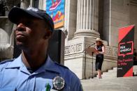 Supporters of author Salman Rushdie attend a reading and rally to show solidarity for free expression at the New York Public Library in New York