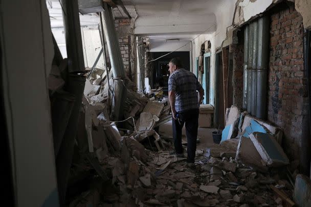PHOTO: A resident looks out from inside the destroyed city hospital of Hulyaypole, Zaporizhzhia Region, Ukraine, July 6, 2023. (Anatolii Stepanov/AFP via Getty Images)