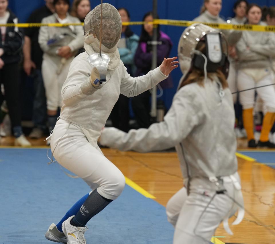 Randolph, NJ -- January 13, 2024 -- Alessa Cooney of Chatham and Abi Conover of Mendham compete at the Morris County Fencing Tournament held at Randolph.