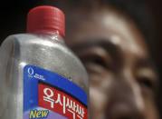 Protestors who claim that a sterilising hygiene product made by Reckitt Benckiser has led to deaths in South Korea, demonstrate ahead of the company's annual general meeting in London, Britain May 5, 2016. REUTERS/Toby Melville